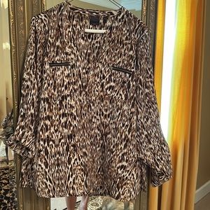 Rafaela animal print blouse with roll tab sleeves.